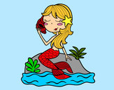 Disegno Sirena seduta su una roccia con una conchiglia pitturato su rocksana